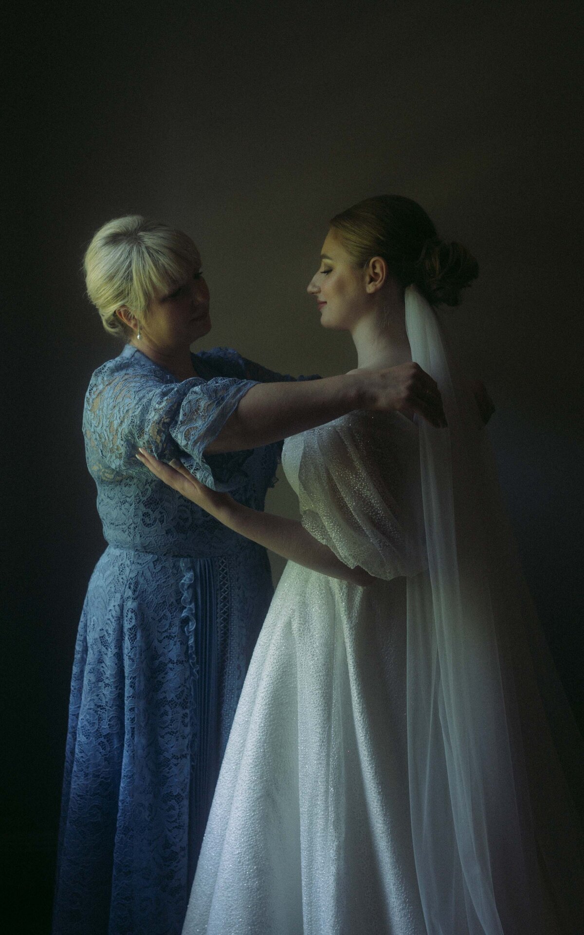 The intimate moments of a bride preparing for her special day in timeless wedding photography.