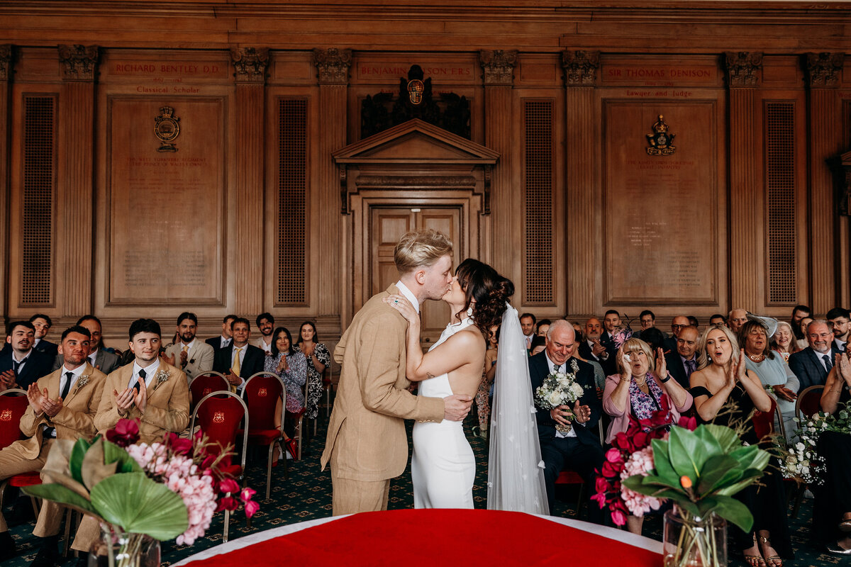 Bride and groom kissing at wedding ceremony at Leeds Civic Hall wedding