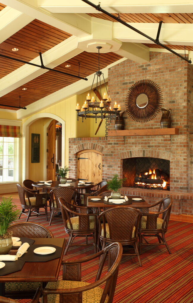 dining room looking at the fireplace at The Reserve Club at St. James Plantation