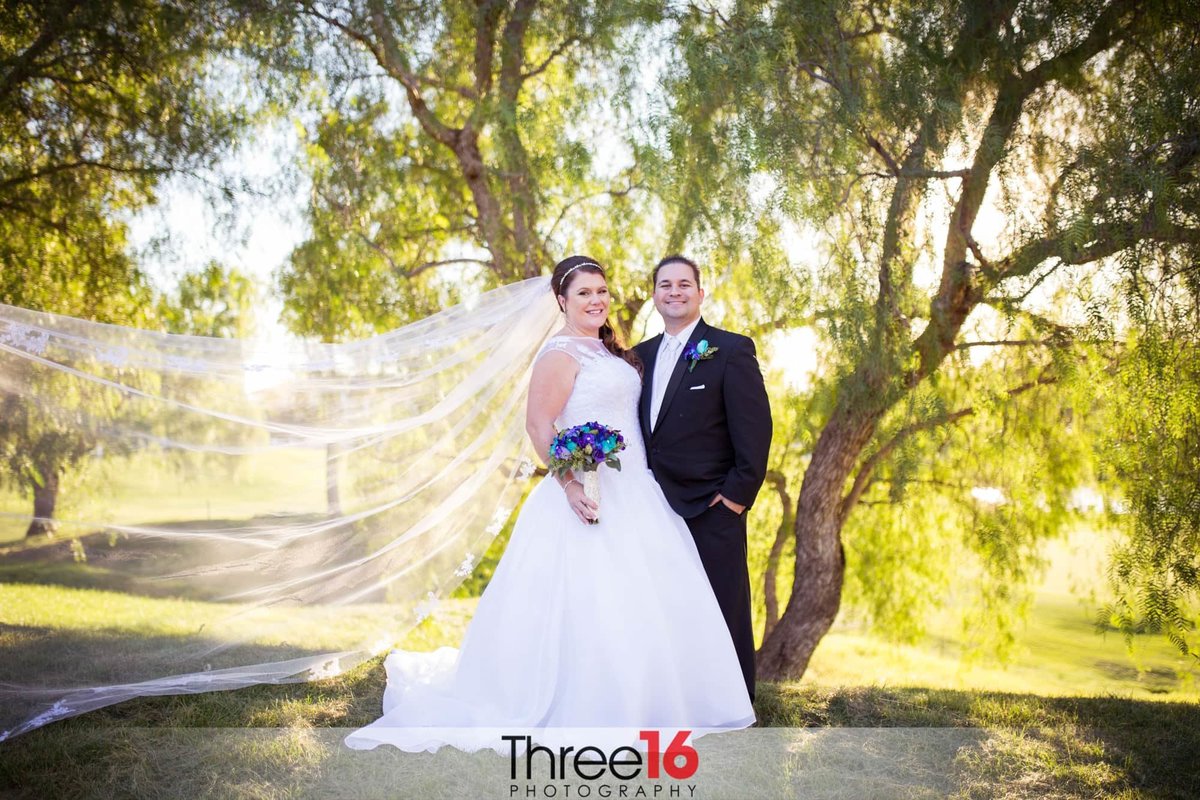 Bride and Groom pose for the photographer