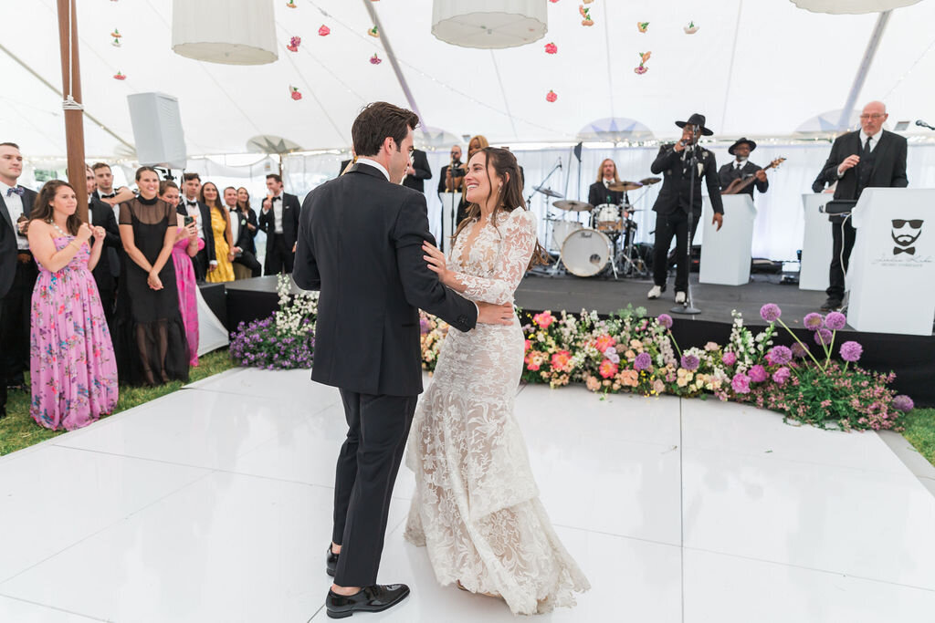 happy bride and groom on dance floor