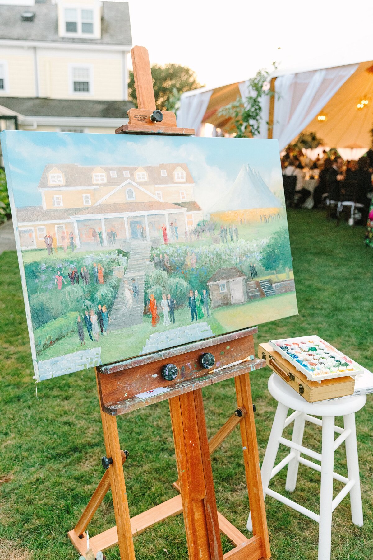 photo of live wedding painter painting the reception tent