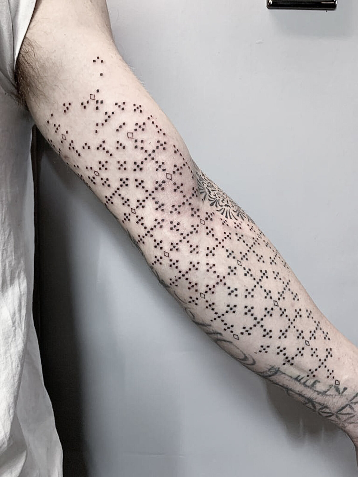 sleeve tattoo, pattern tattoo, crosses tattoo, geometric tattoo
