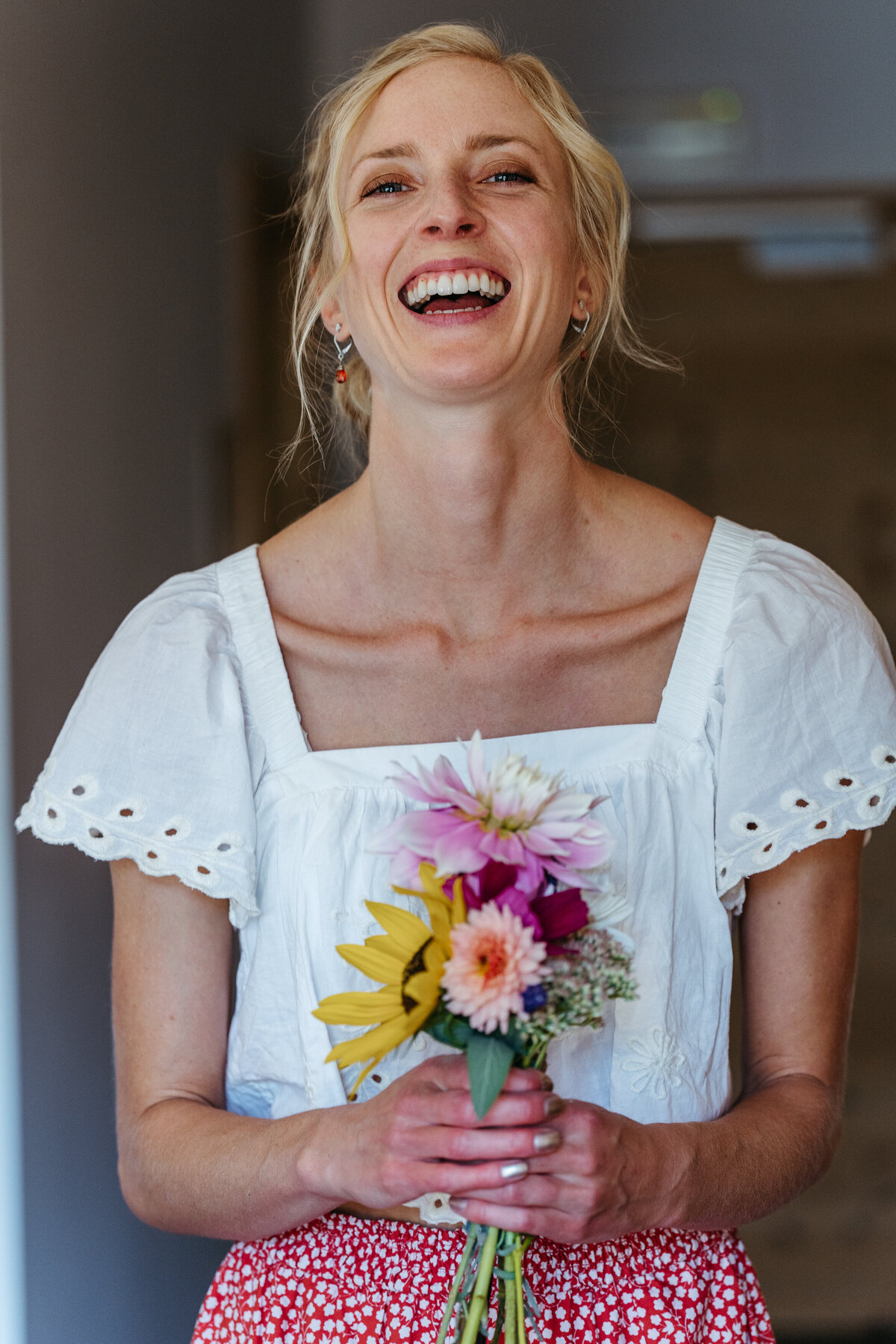 Bride holding handmade wildflower bouquet