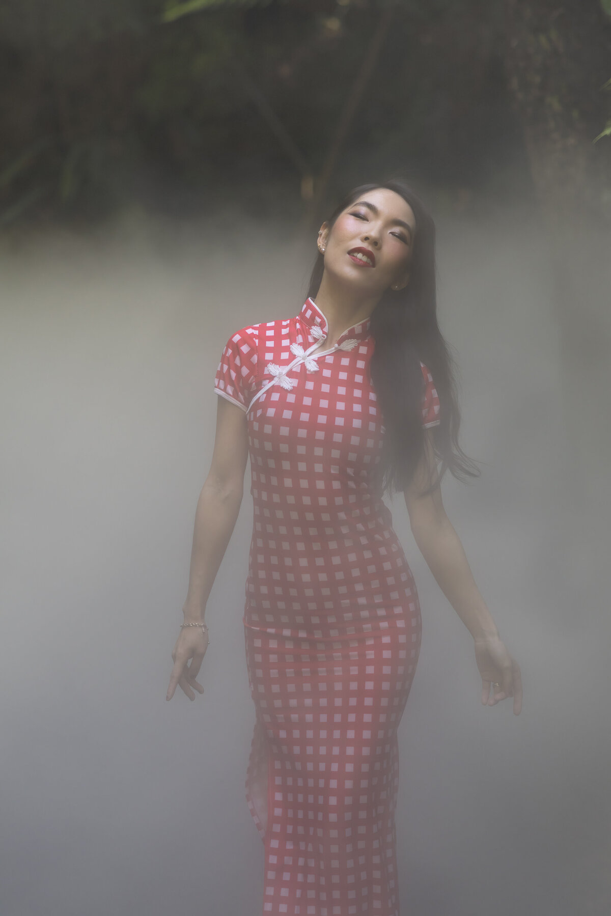 Woman in mist eyes closed