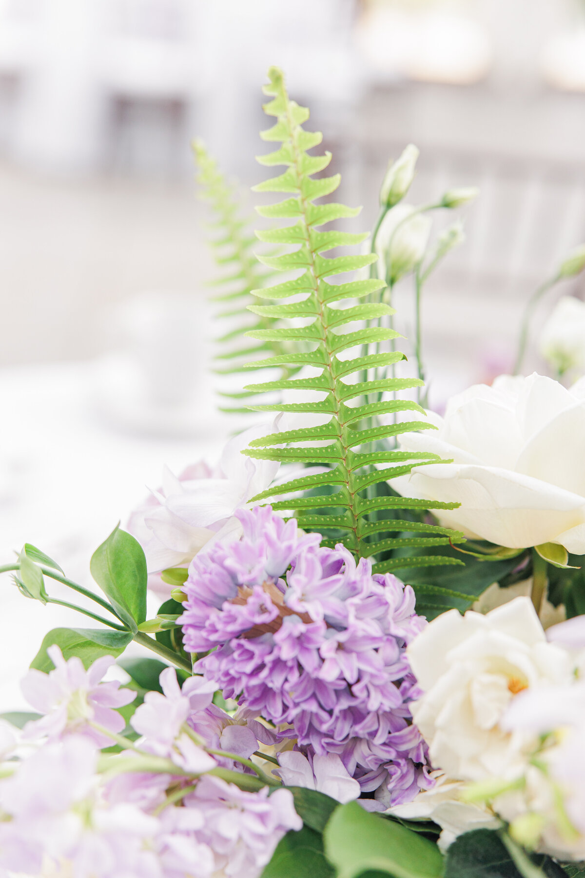 Close up of purple floral centerpiece during Tower Hill wedding