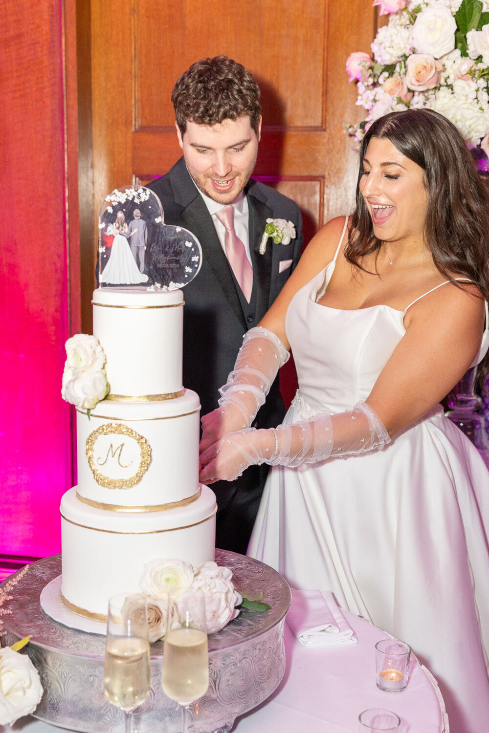 Couple cutting their wedding cake