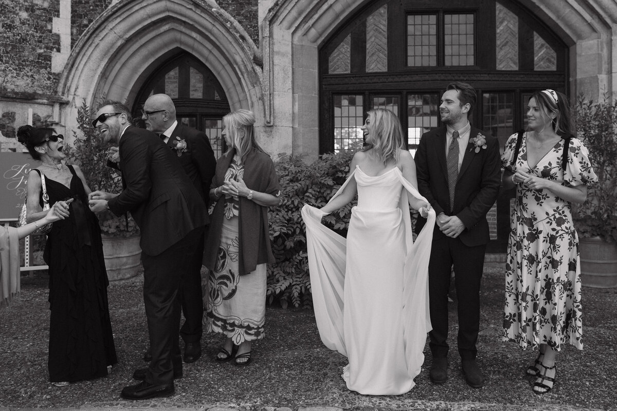Wedding photographer captures couple taking a stroll hand in hand at their french chateau wedding.