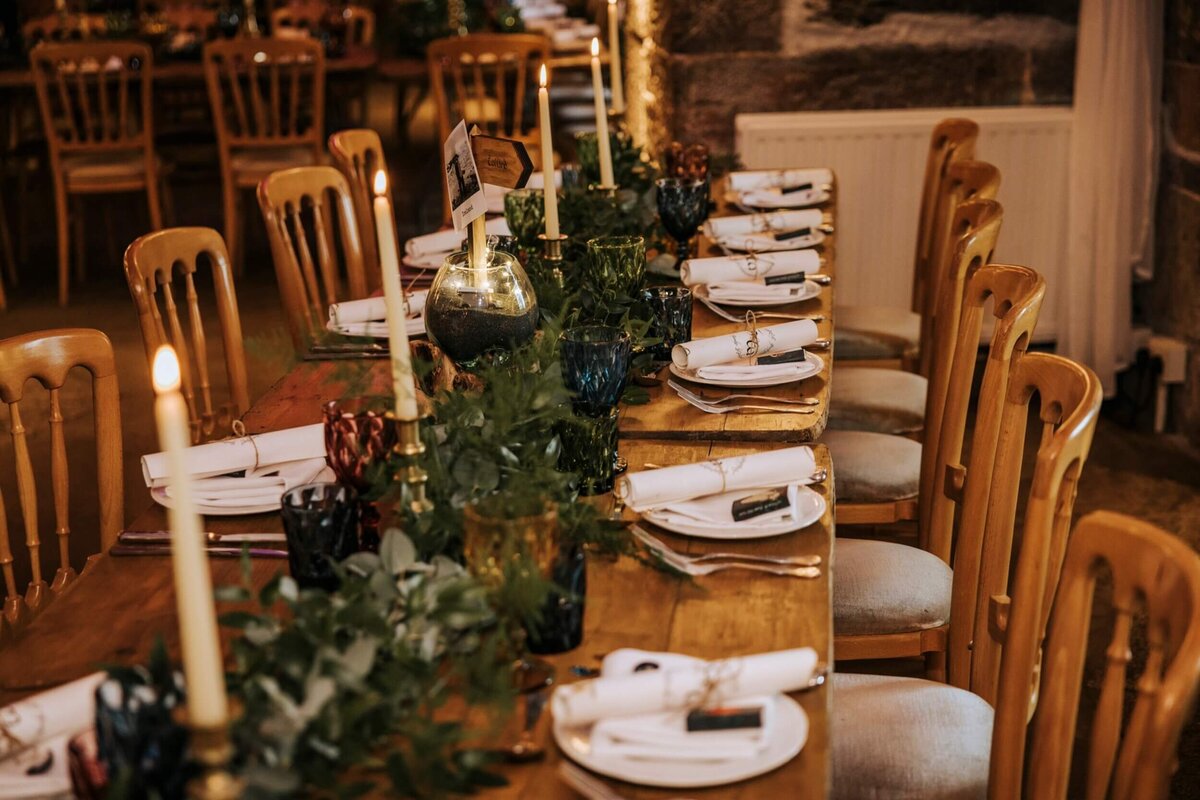 A long table set with place settings and place settings