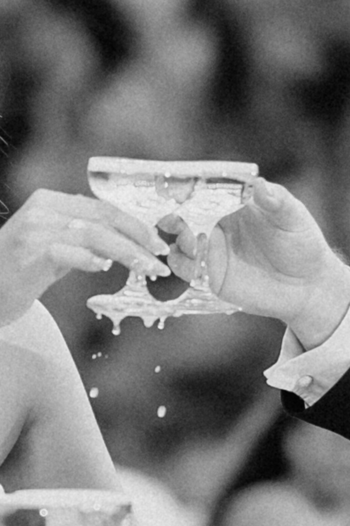 Two glasses cheering and champagne overflowing