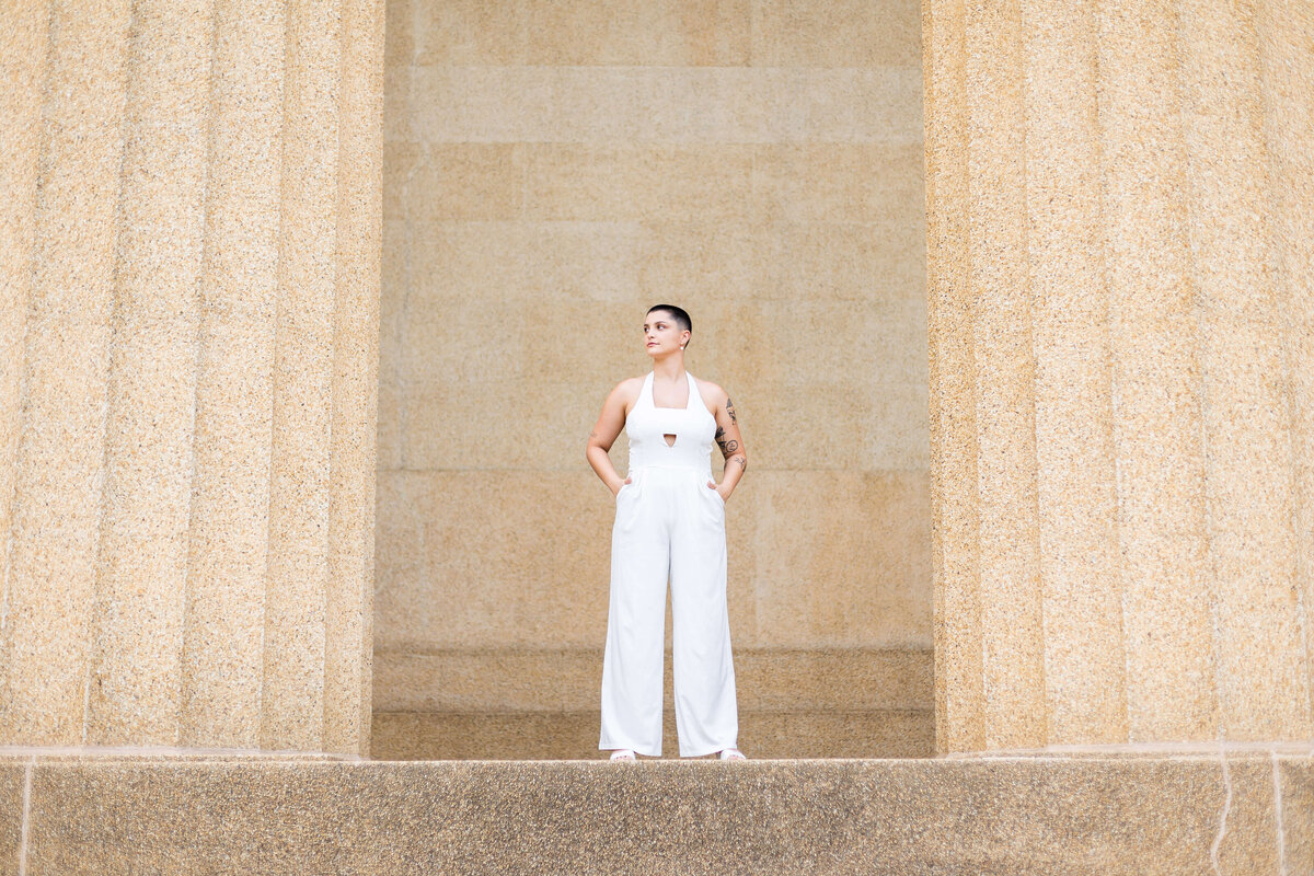 Woman wearing white jumpsuit at LGTBQ wedding in Centennial Park, Nashville,TN