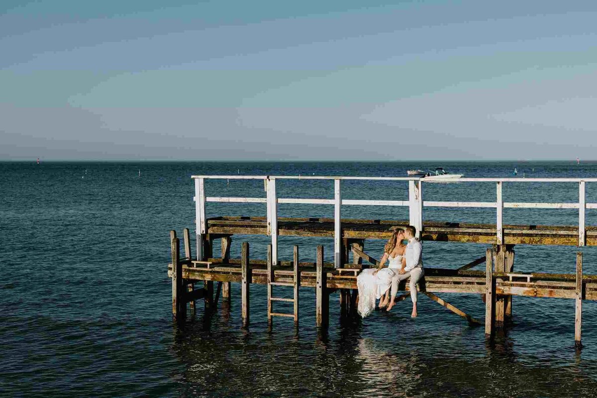 couple_sitting_on_peir