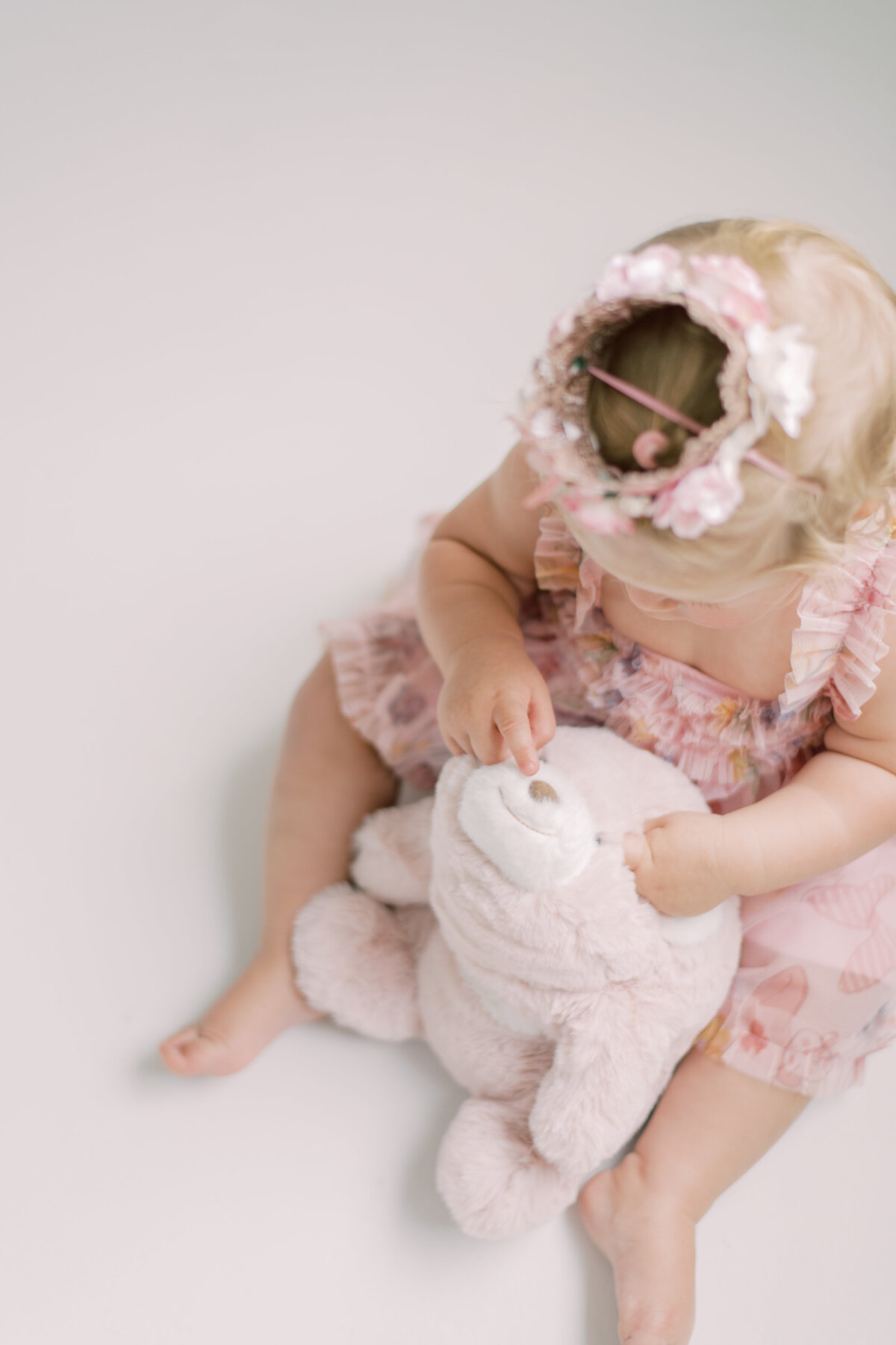 Birthday girl with stuffed animal in Burlington at the Pearle Studios