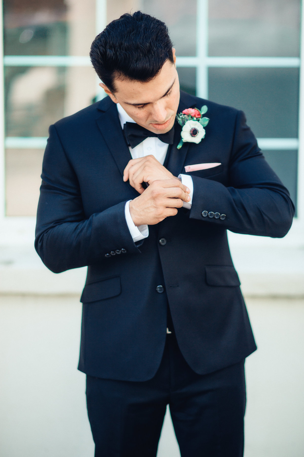 Wedding Photograph Of Groom Fixing His Black Suit Los Angeles