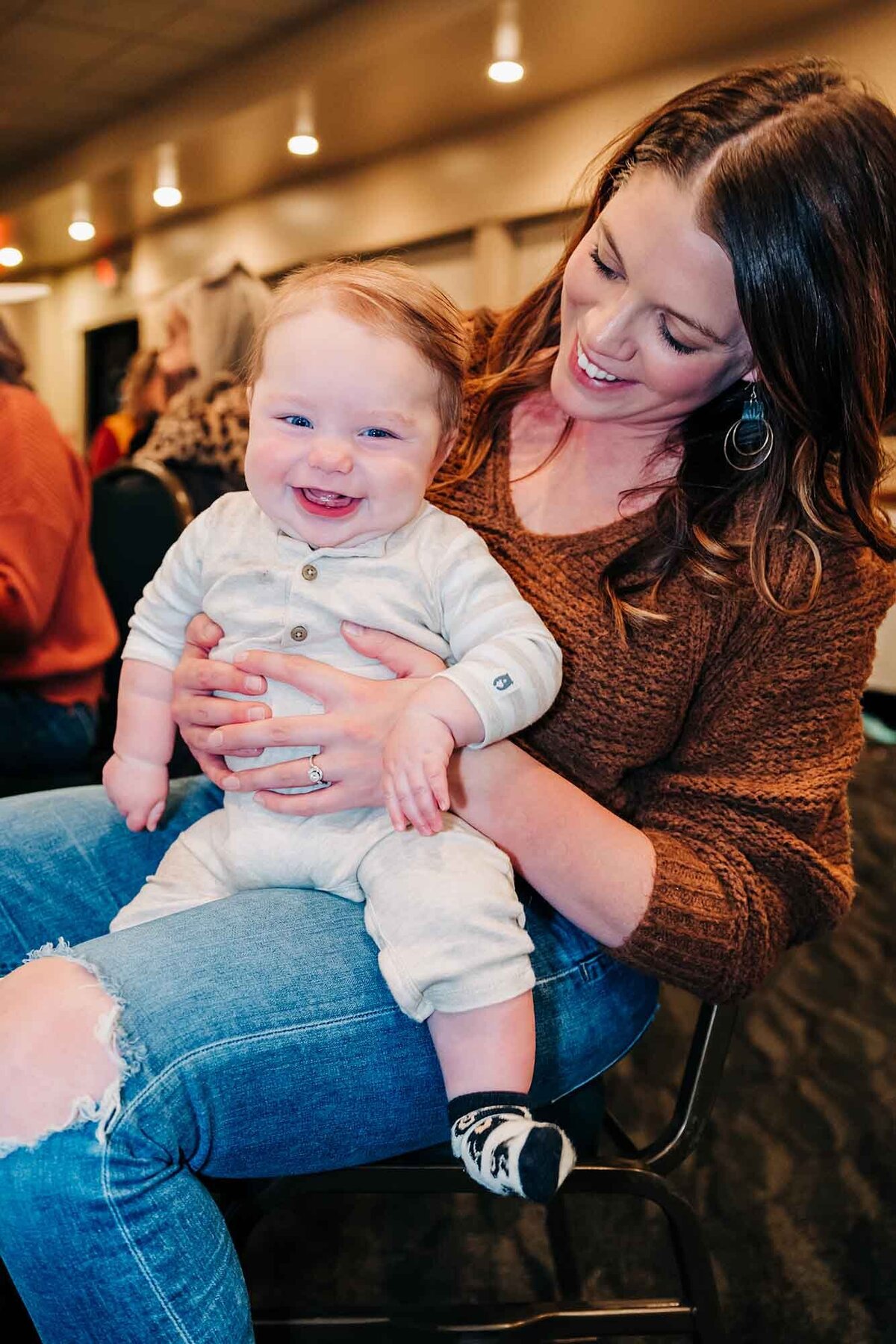 Happy baby laughing at birthday party in Missoula, MT