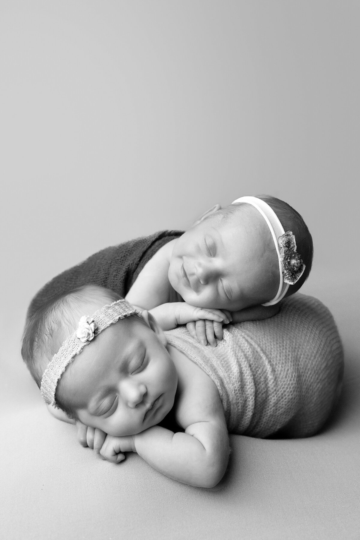 twin newborns together