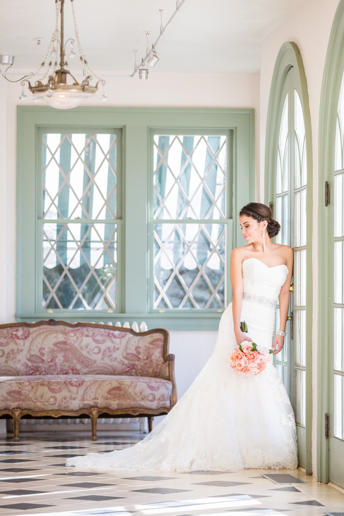 Bride poseing in a beautiful windowed room at Laguna Gloria in Austin