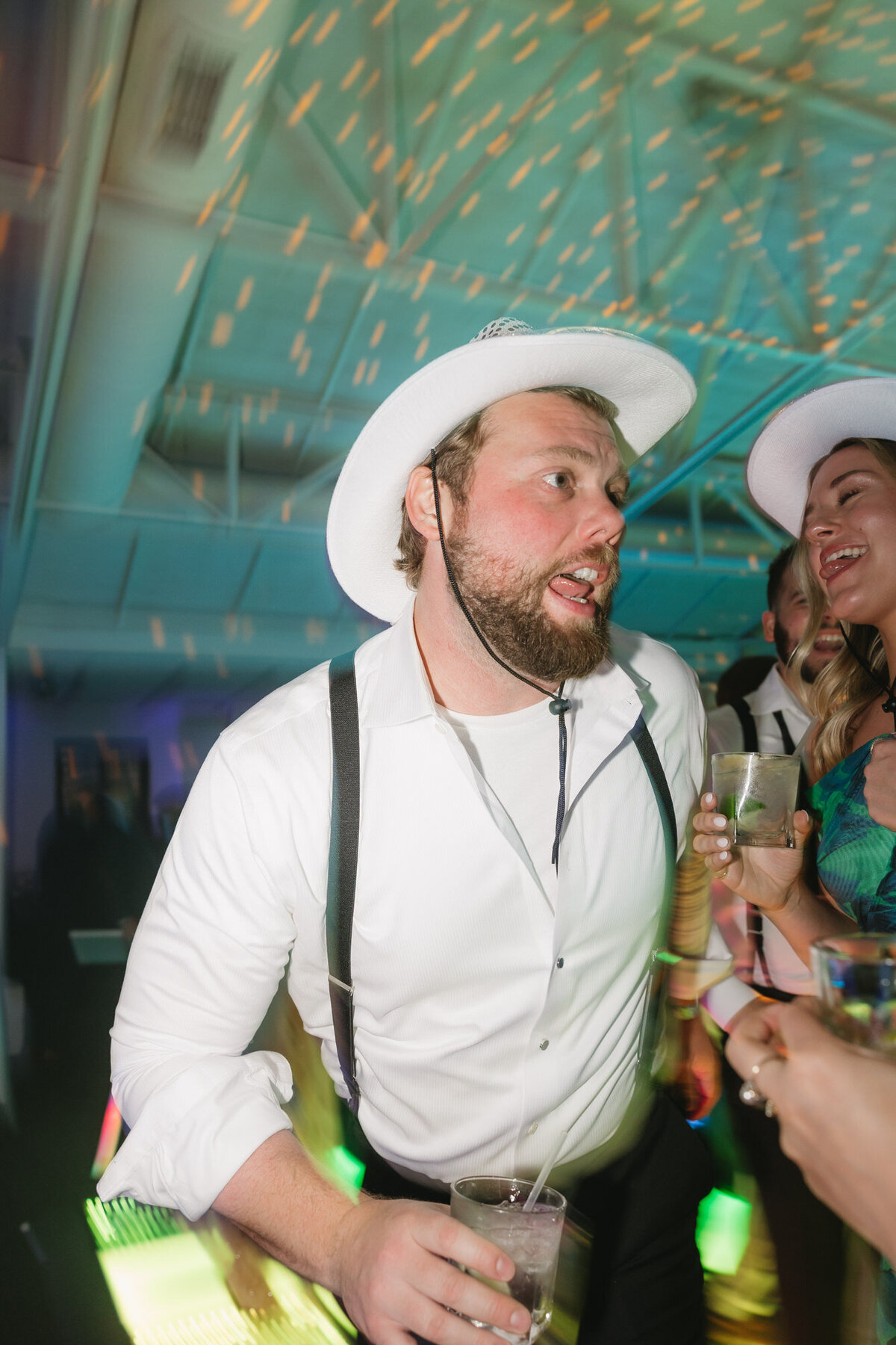Guests dancing on dance floor at reception at El Chorro