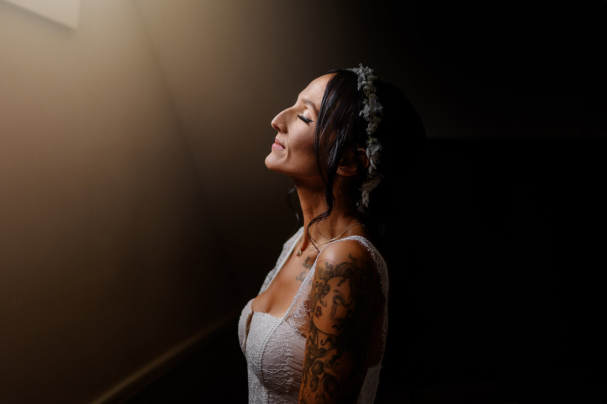 Bride taking a deep breath in getting ready room