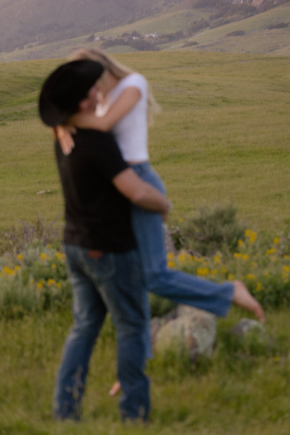 Couples Engagement Photos in field candid kiss in San Luis Obispo 