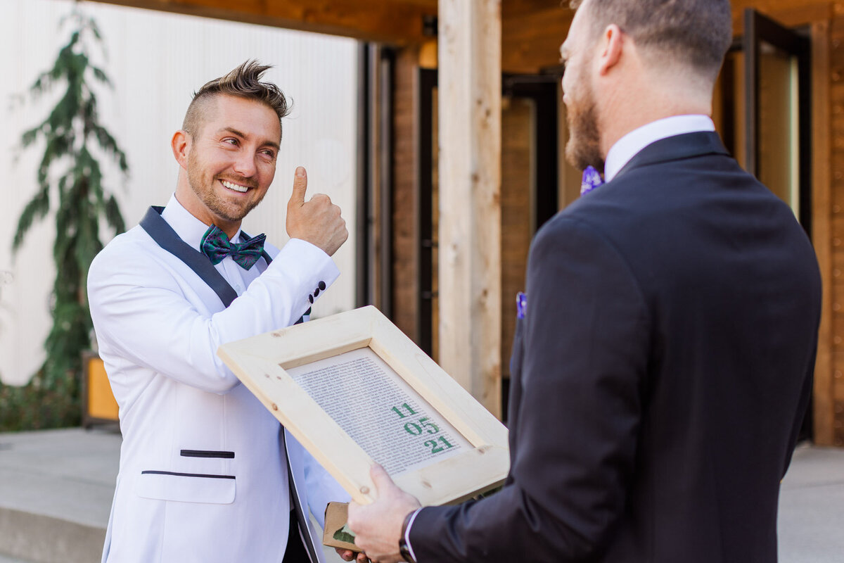 Grooms-exchange-gifts-at-their-fall-wedding-at-Liljebeck-venue-in-Woodinville-WA-photo-by-Joanna-Monger-Photography