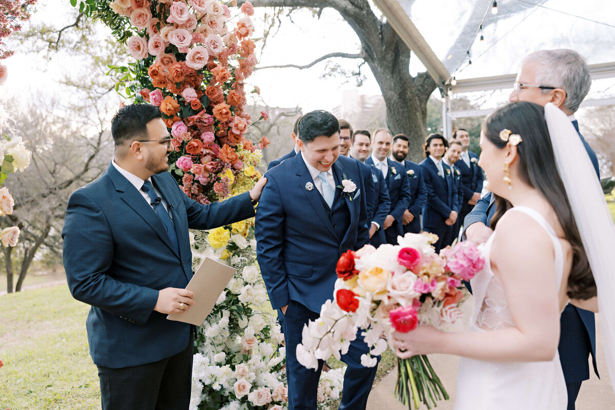 Colorful wedding ceremony arch by Posey Designs at The Four Seasons Austin