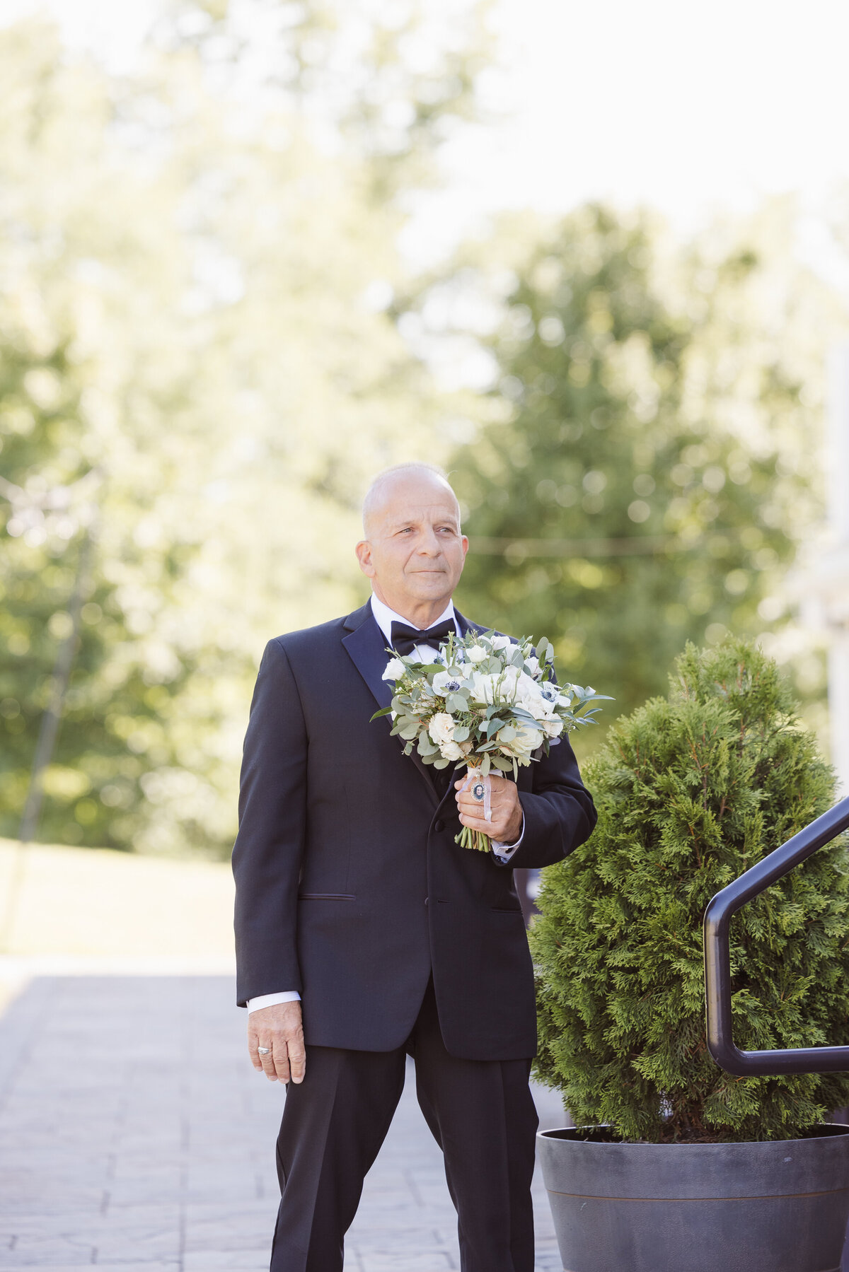 father of bride waiting for the bride