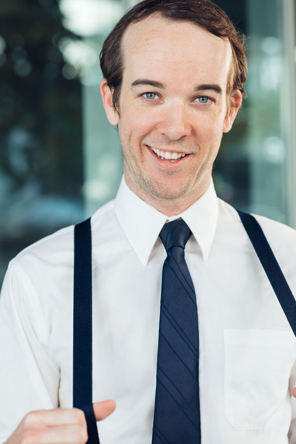 Young Man Wearing White Long Sleeve with Navy Blue Necktie and Suspender Headshot in LA
