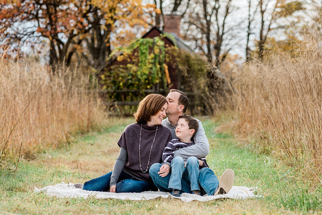 family of three sitting on a blanket in Morris County NJ