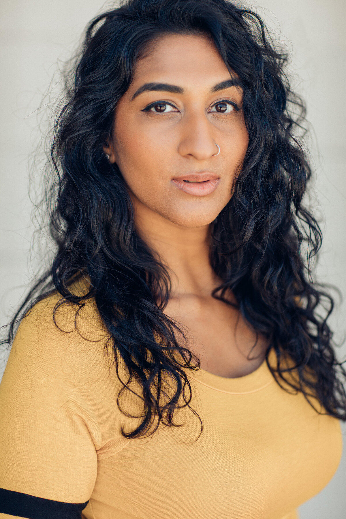 Headshot Photograph Of Young Woman In Yellow Shirt Los Angeles