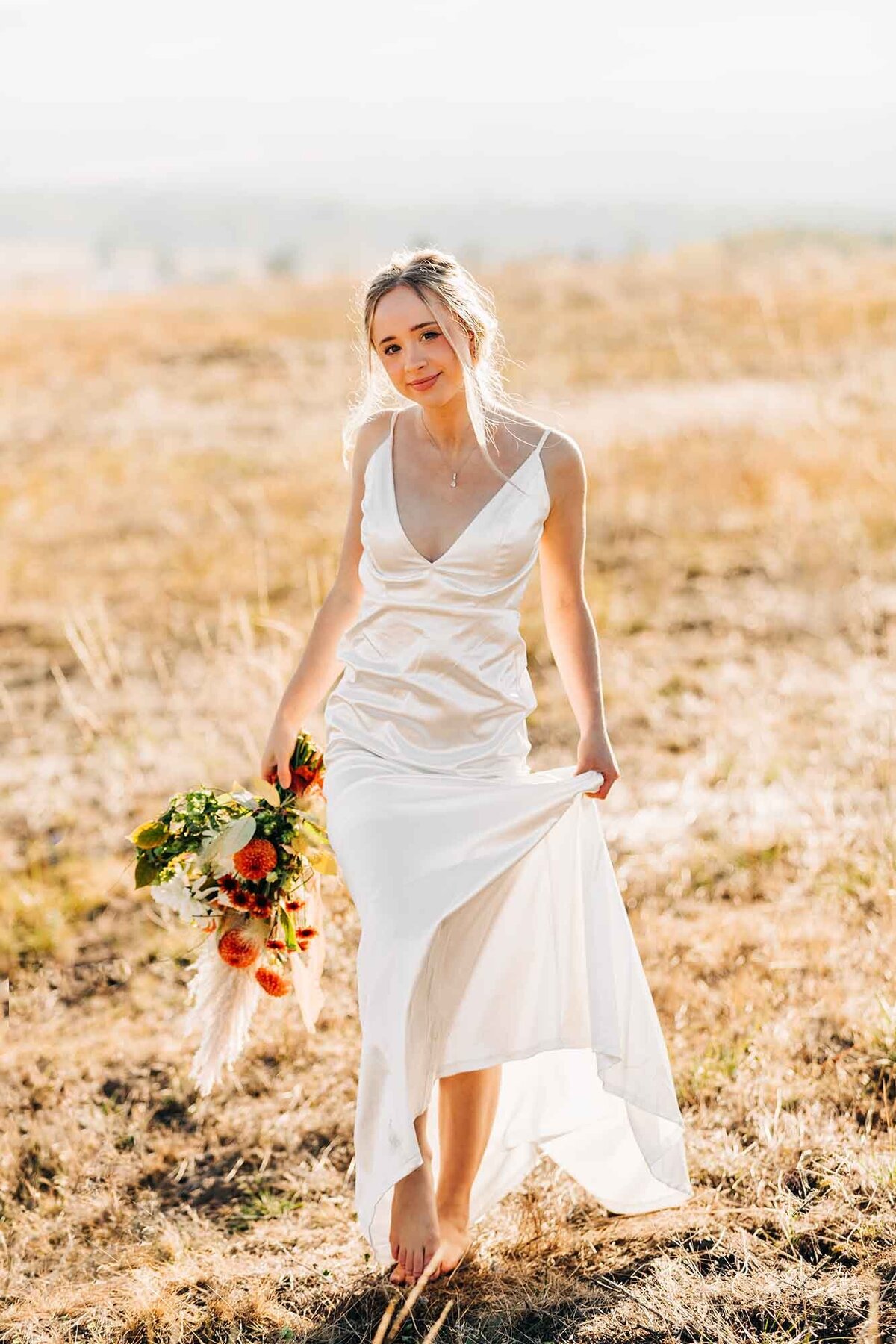 Missoula bride walking in field, Blue Mountain, Missoula