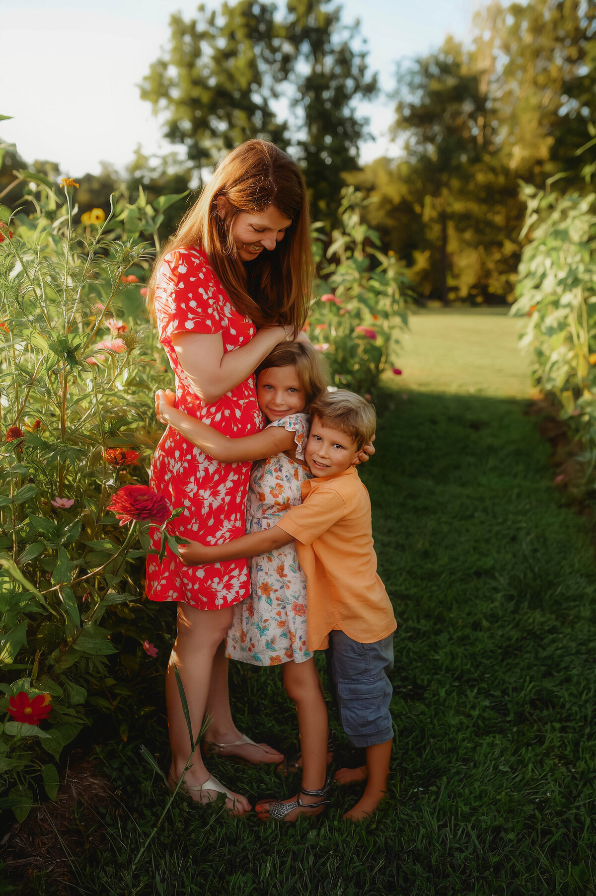 Mother embraces her children during Family Photoshoot in Asheville, NC.