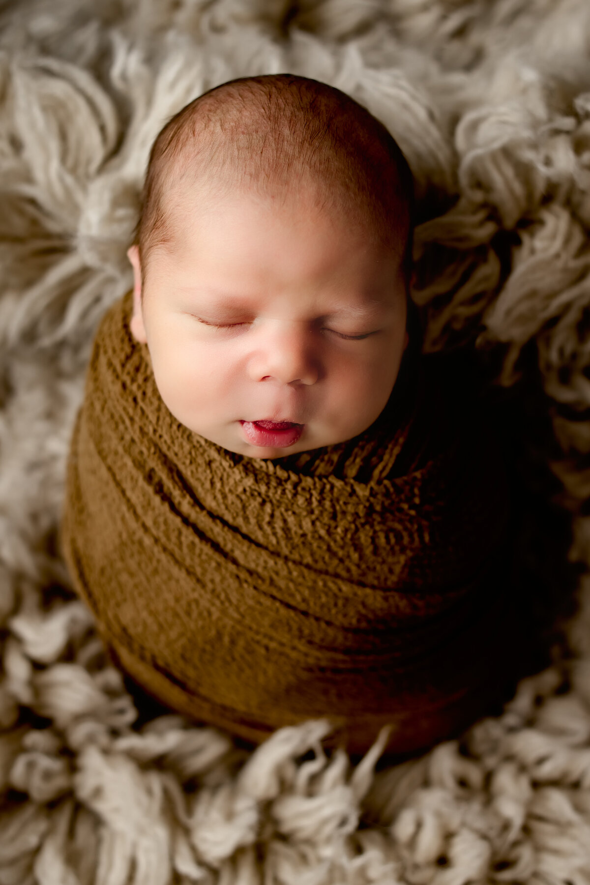 The Woodlands, Tx little baby boy wrapped up photoshoot