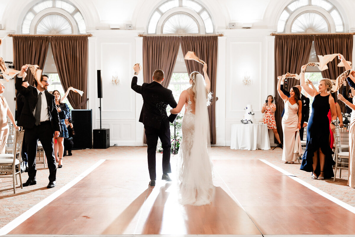 couple entering their wedding reception at the university club pittsburgh