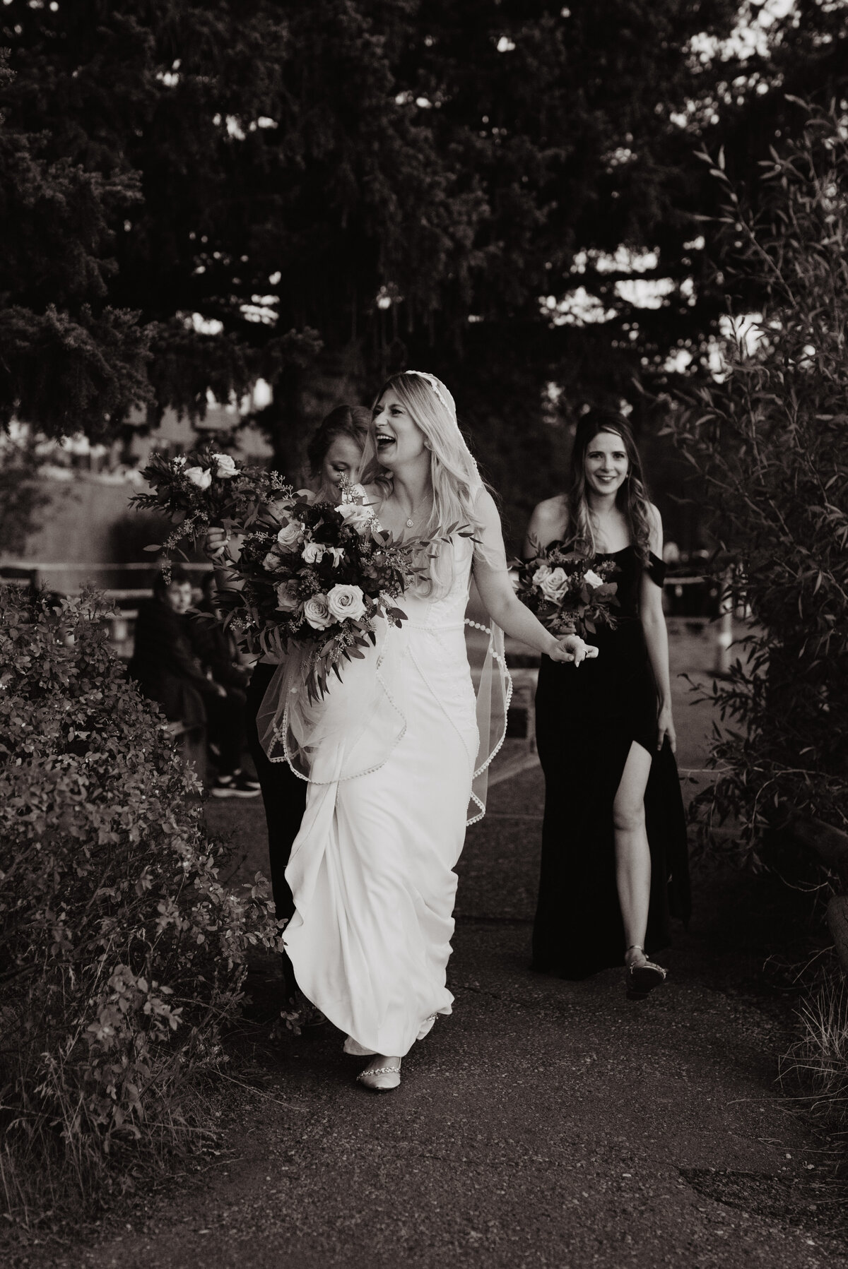 Photographers Jackson Hole capture bride walking with wedding party