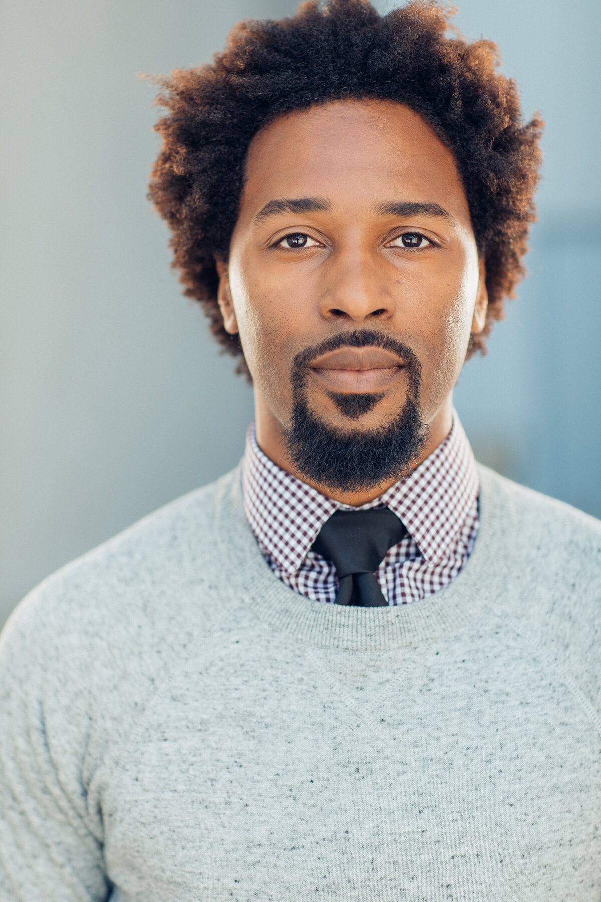 Young Man Wearing Grey Sweater with Inner Stripe Long Sleeve and Necktie Headshot in LA