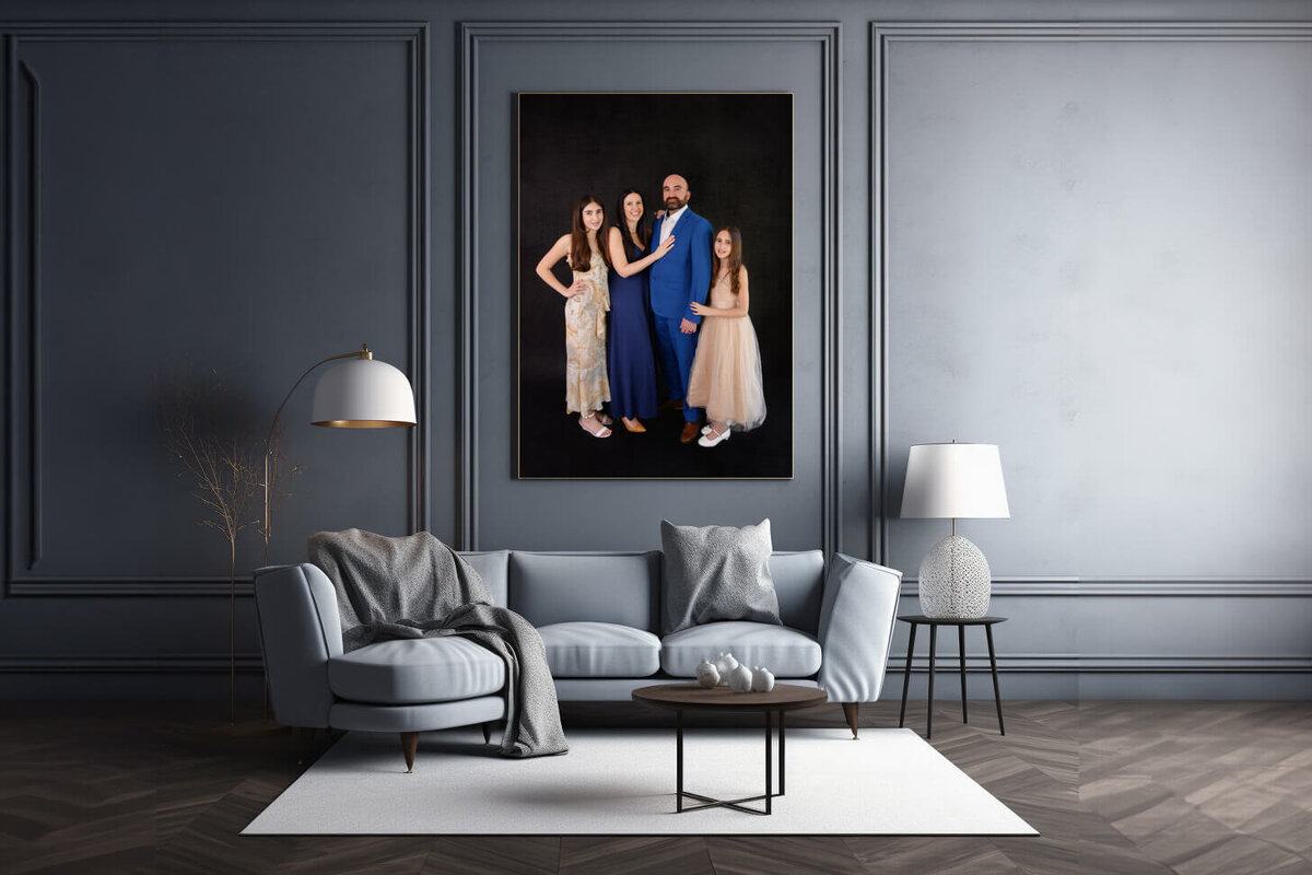 Grey living room with a photo of a family in studio for their family photography session