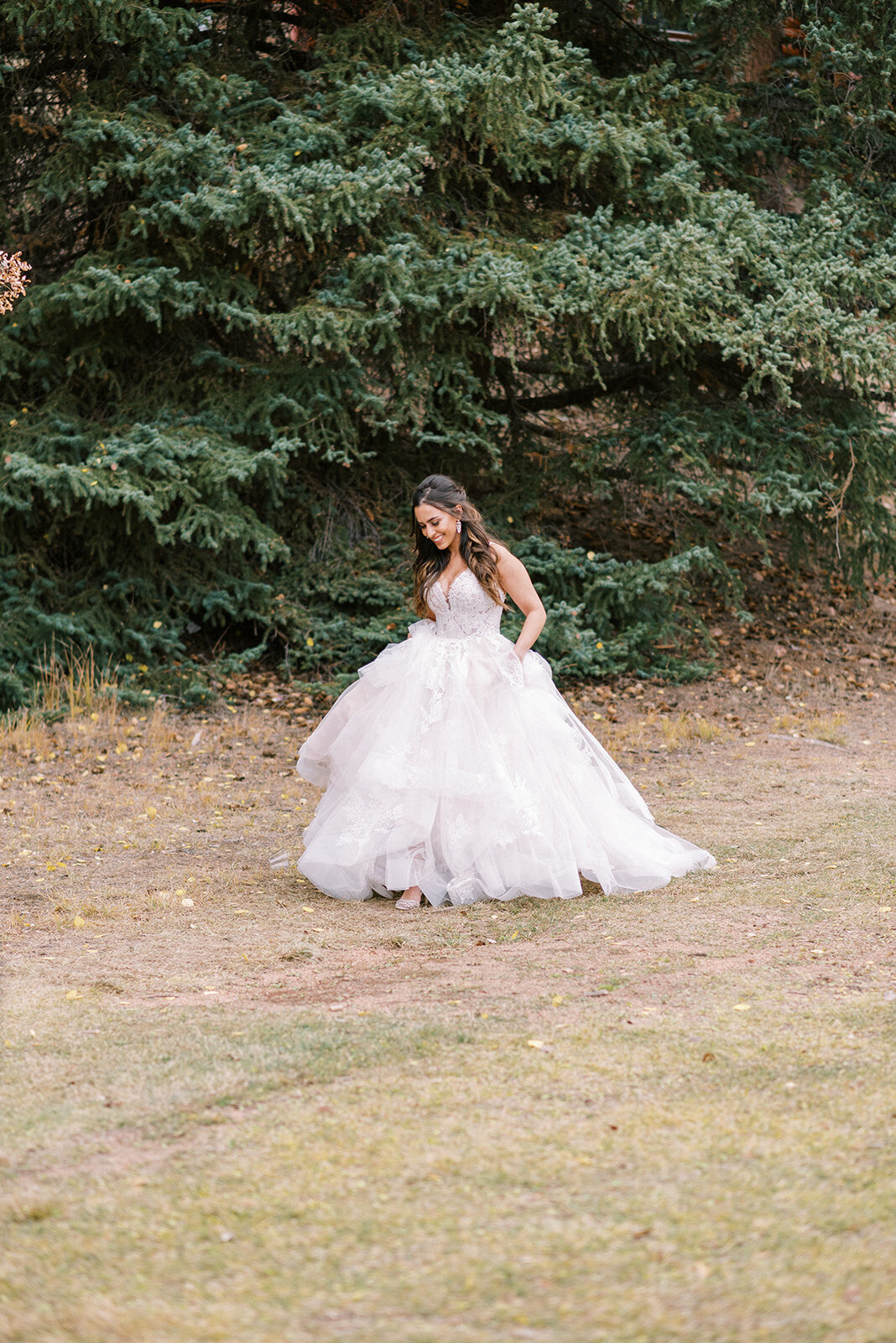 bride walking in a field