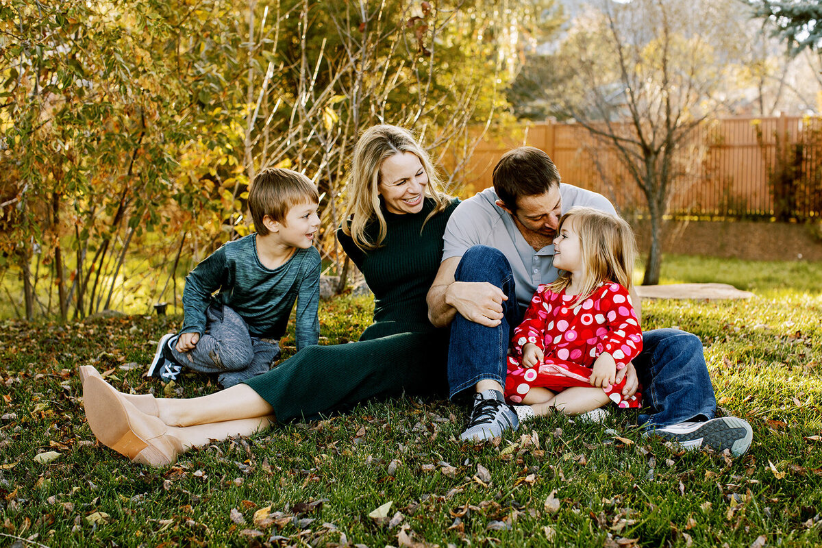 a family plays a game during an outdoor photoshoot