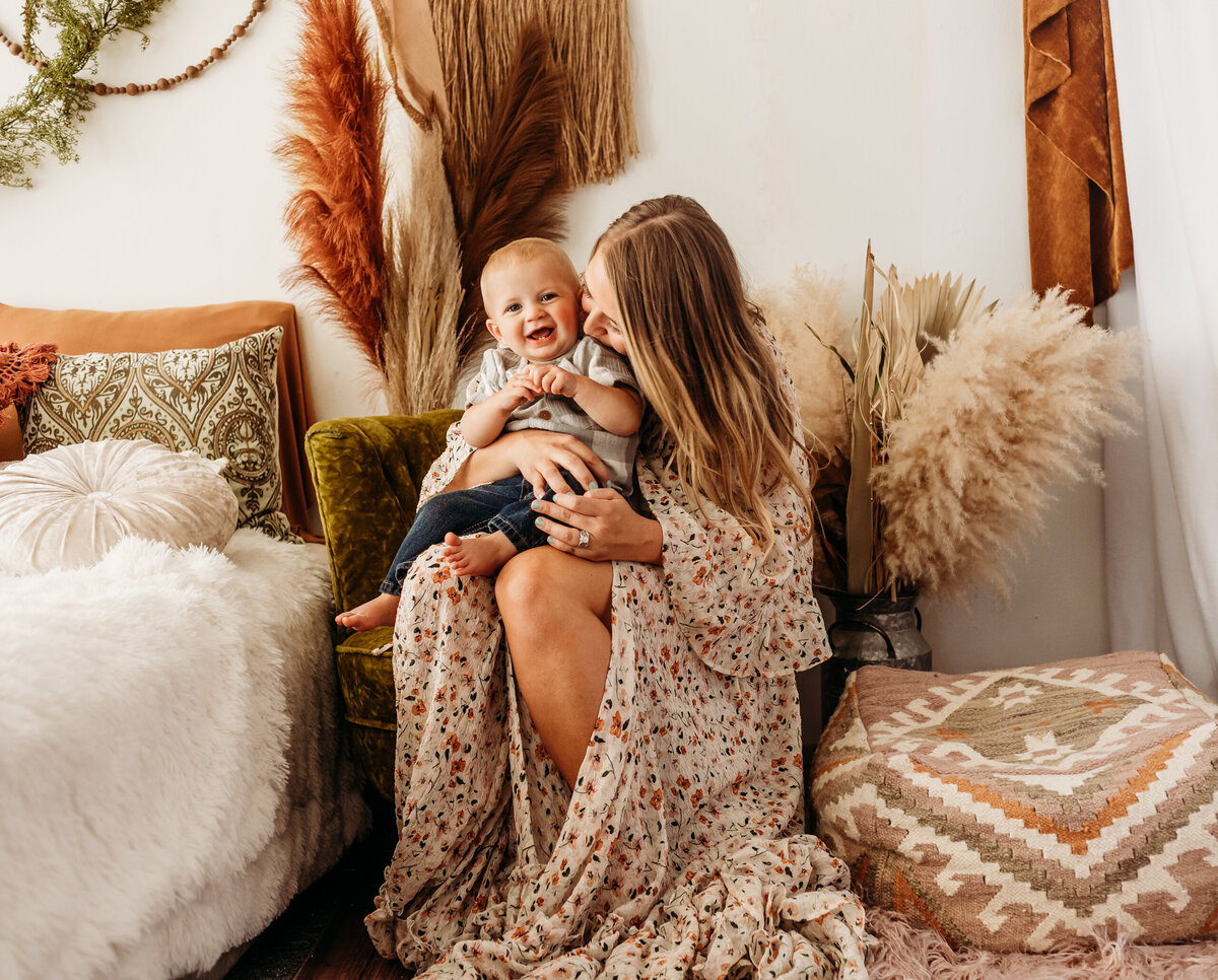 Mother holding a smiling toddler