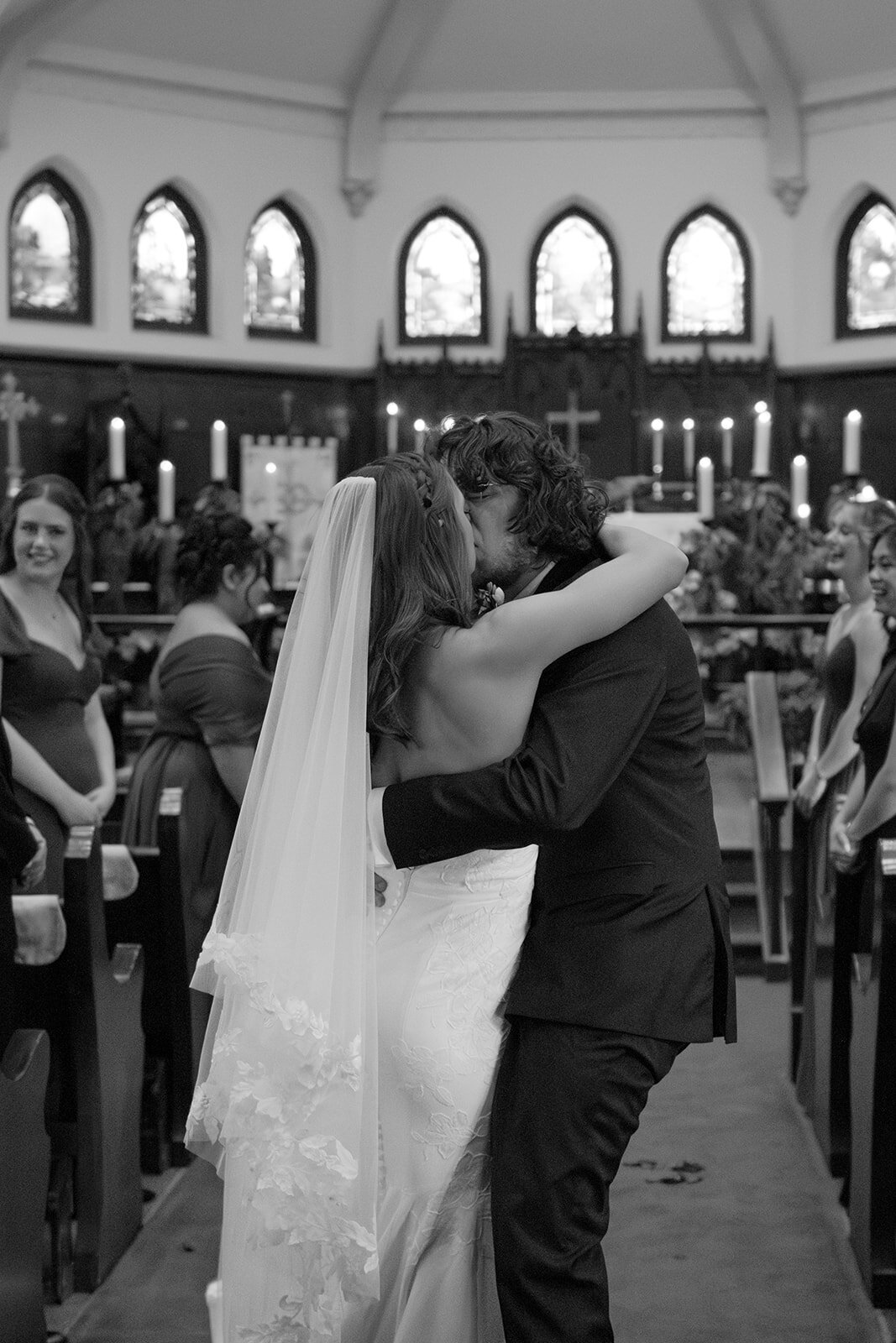 Bride and groom isle kiss down the aisle after ceremony with joyful guests at San Antonio venue