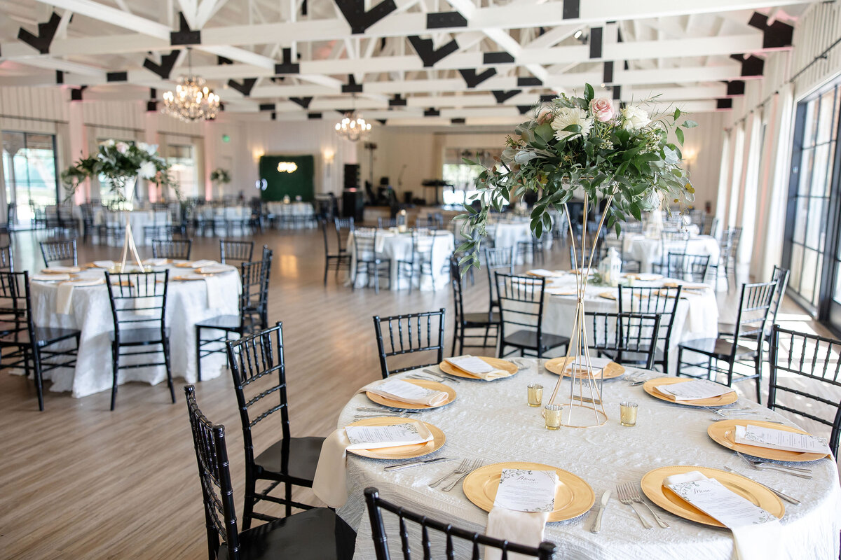 wedding reception at Milestone Georgetown Texas black and white with tall vases