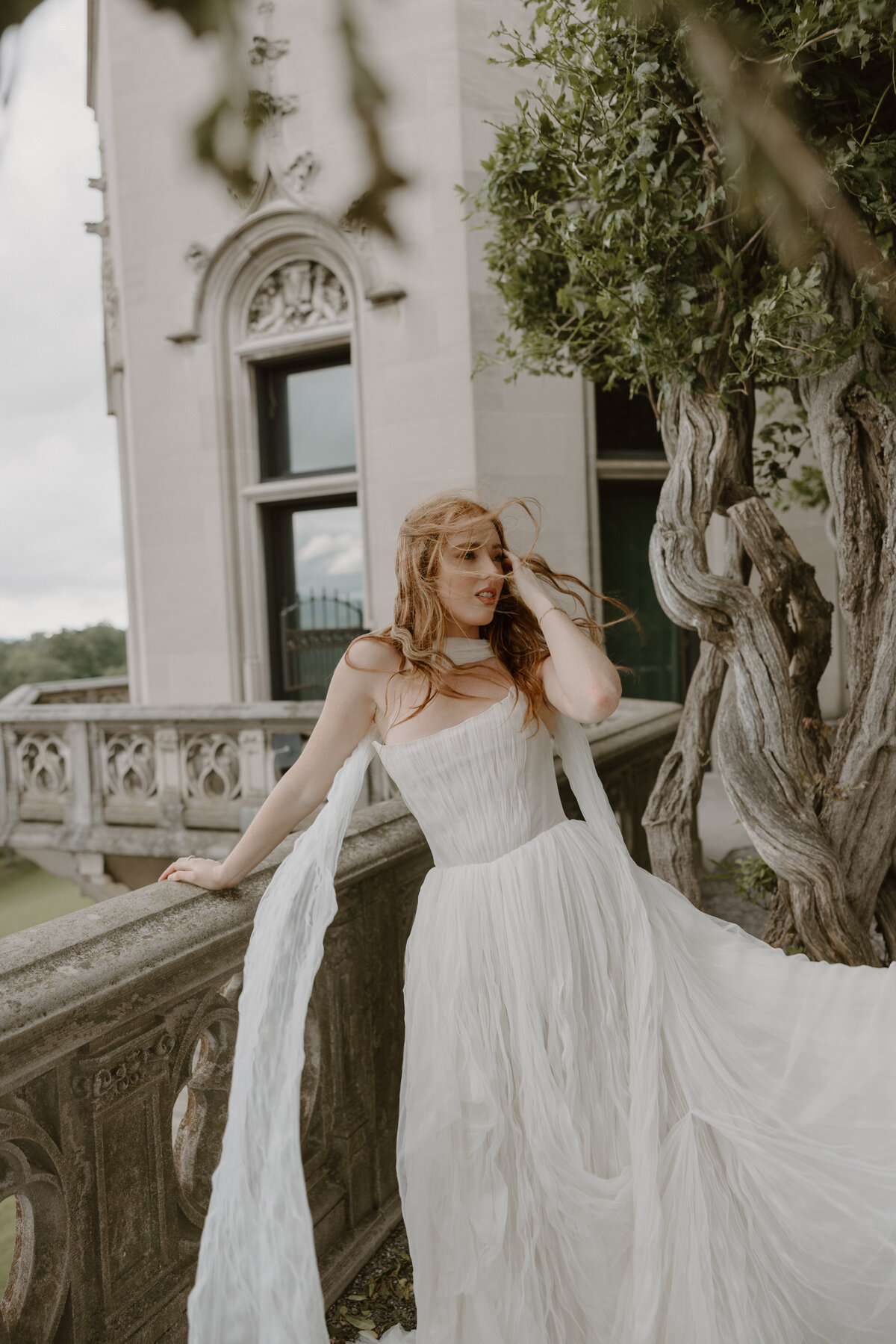 Bride’s hair and dress caught beautifully in the wind at the Biltmore Estate, adding movement and emotion.
