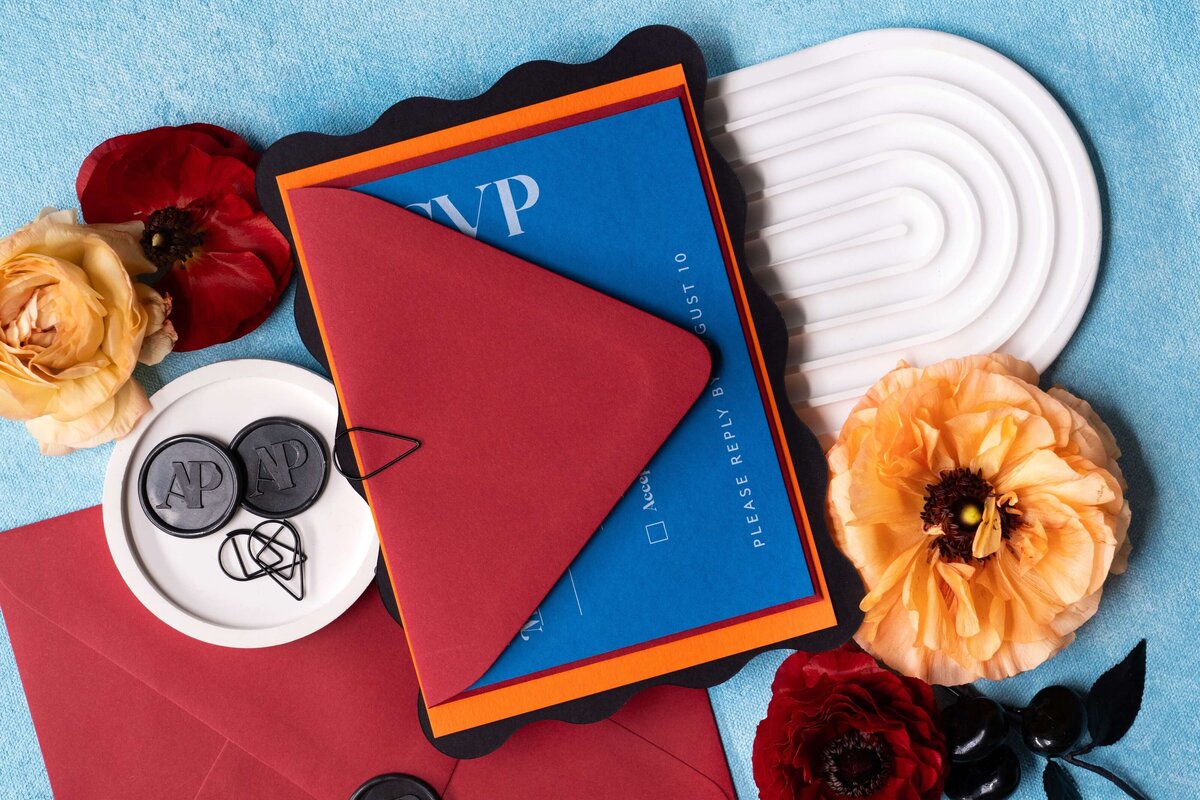bright-colors-custom-wedding-invitations-black-wax-seal-orange-blue