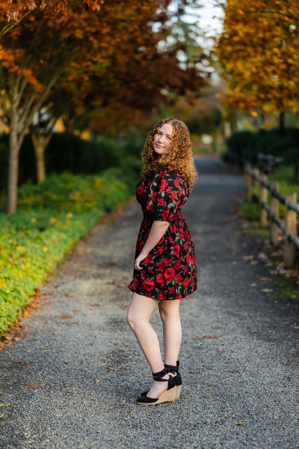 bellevue high school senior girl in floral dress at fall garden