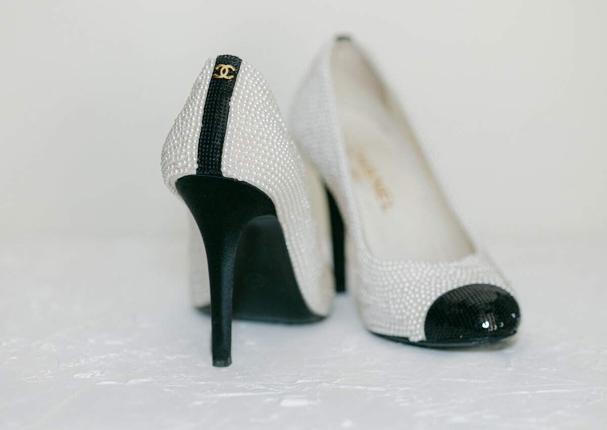 up close detailed photo of brides wedding shoes