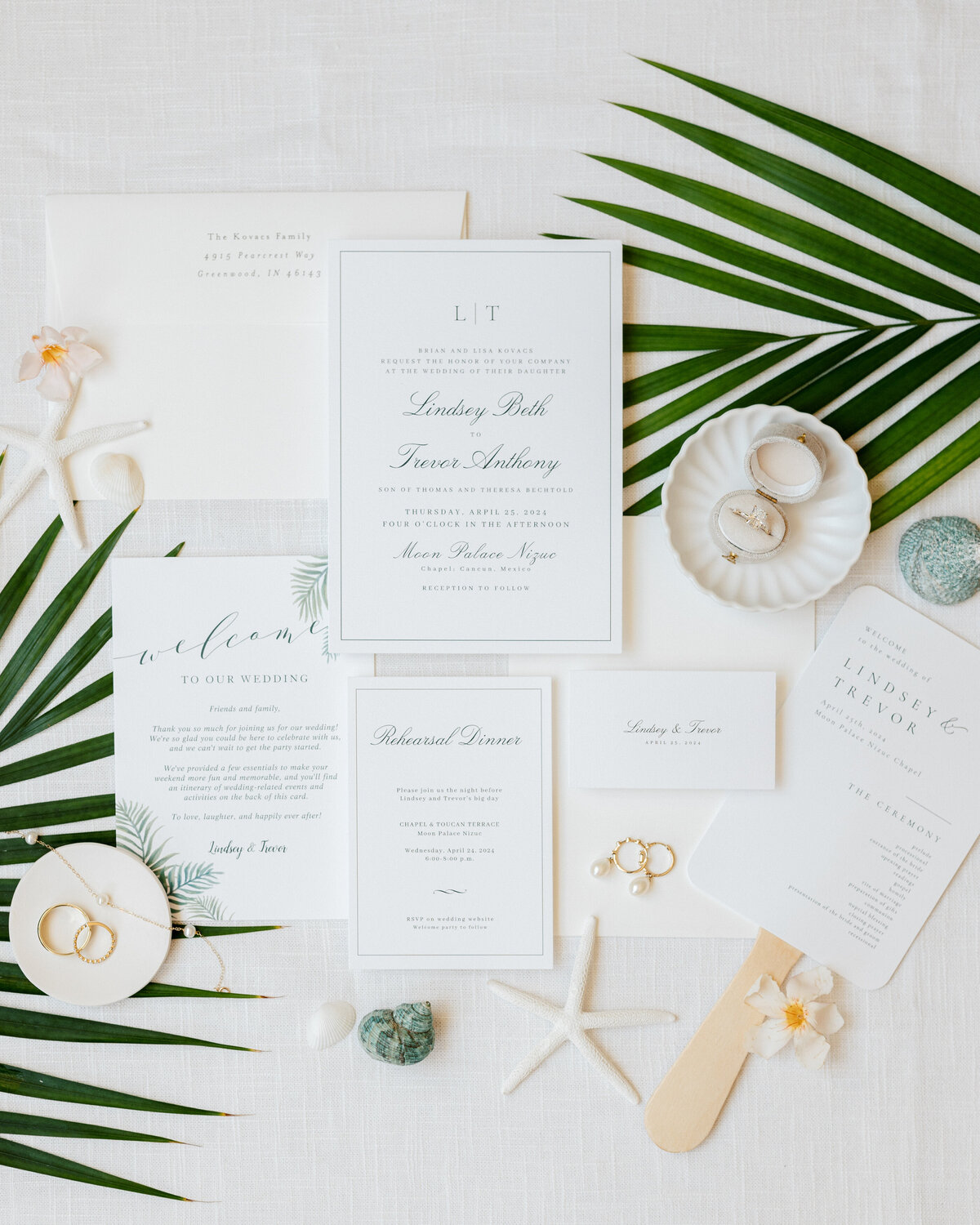 Cancun wedding invitation suite with shells and pearls, beautifully styled by a Philadelphia-based wedding photographer.
