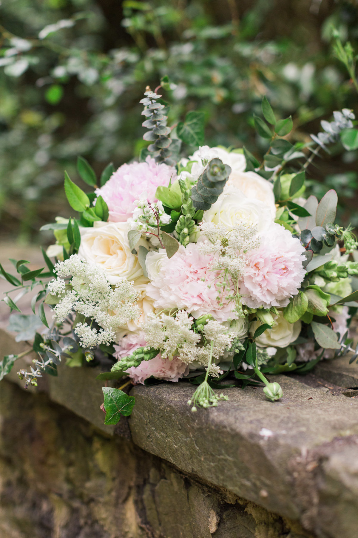 This bridal bouquet was made up of peonies and roses. Photo by luxury destination wedding photographer Rebecca Cerasani.