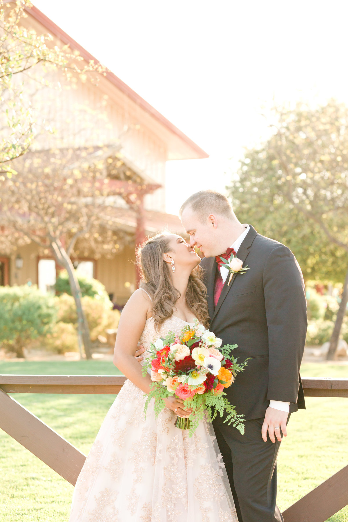 bride and grrom kissing bridal formal portraits