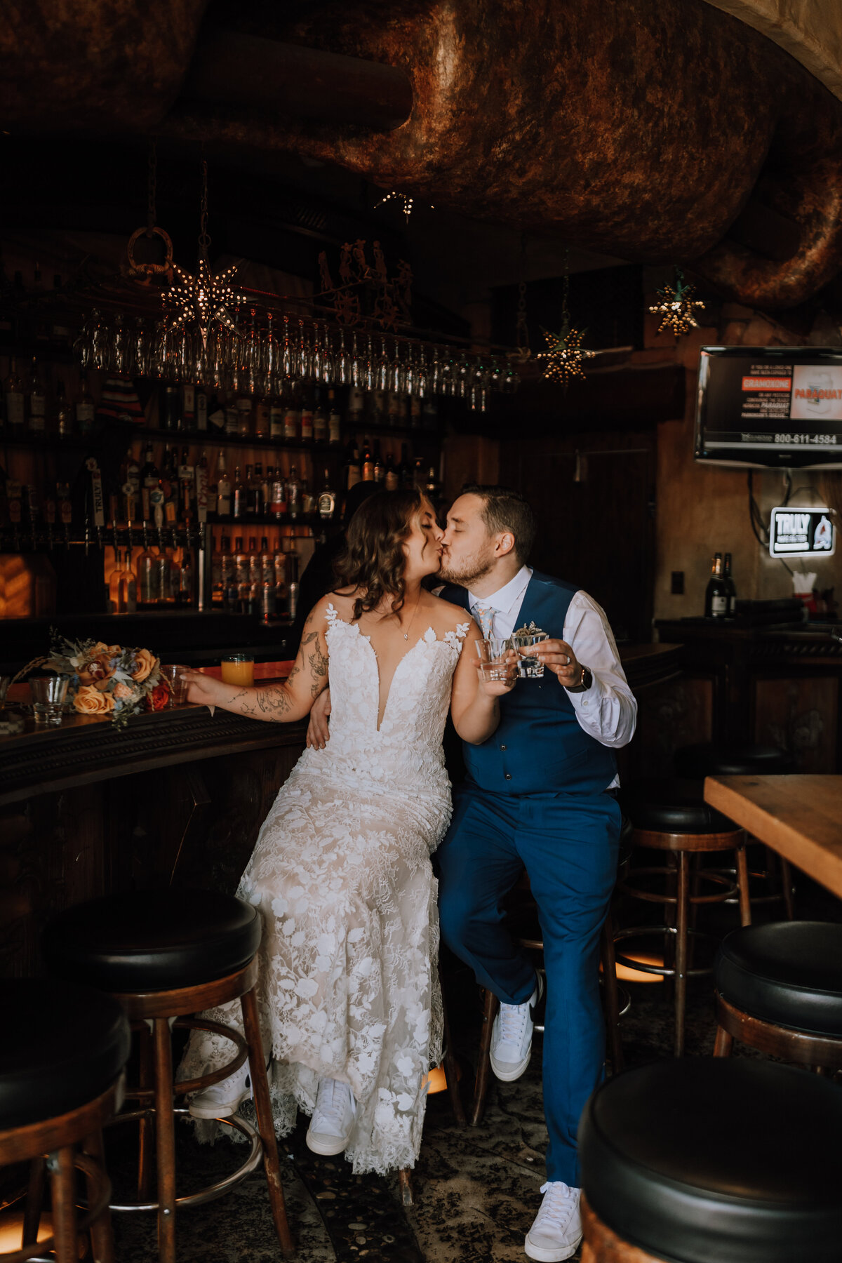 bride and groom drinking tequila at colorado bar